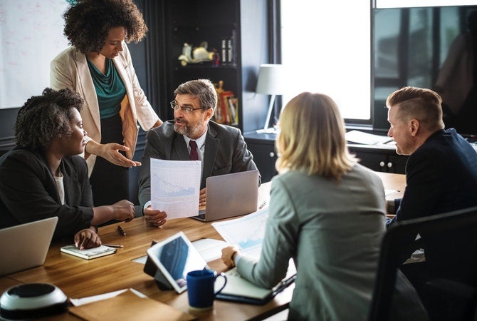 Several lawyers meeting in a board room