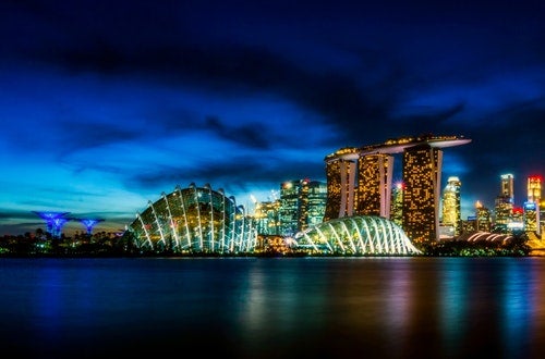 Landscape of Singapore at night as seen from the water