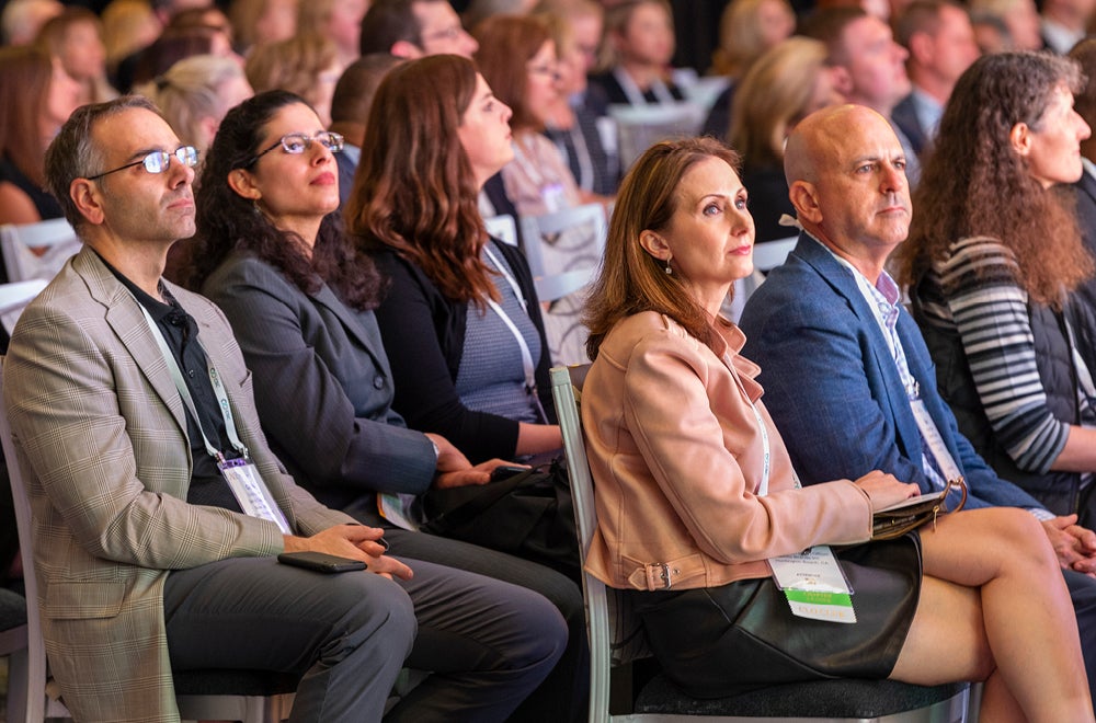 group of seated people watching presentation