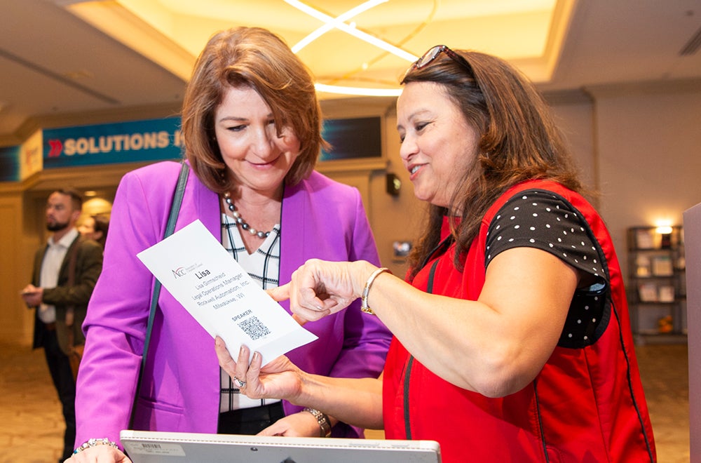 two women read paper