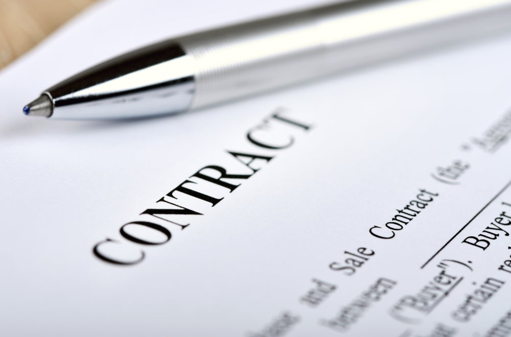 Contract page with text and pen