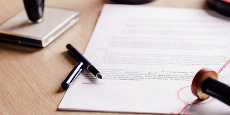 contract on table with pen