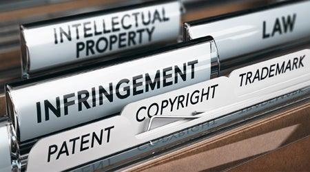 file folders labelled intellectual property, law, infringement, and copyright