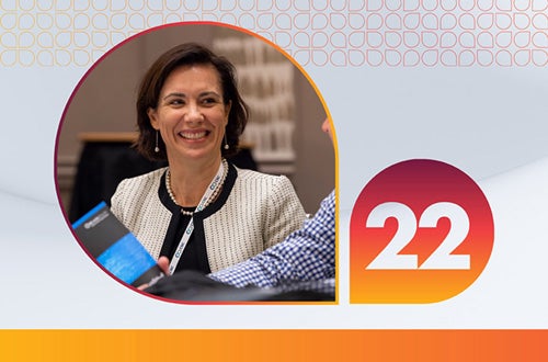 woman in an orange circular design next to the number 22 