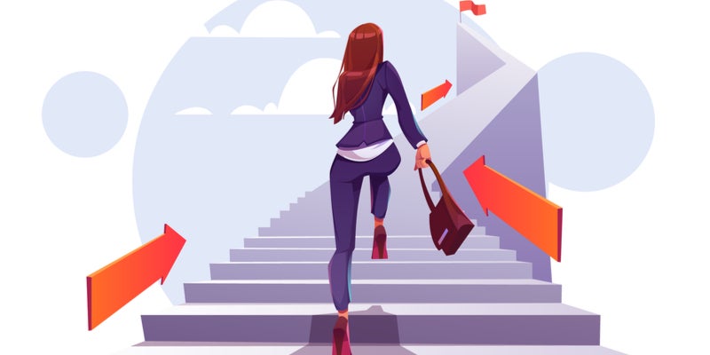 A business woman climbing stairs