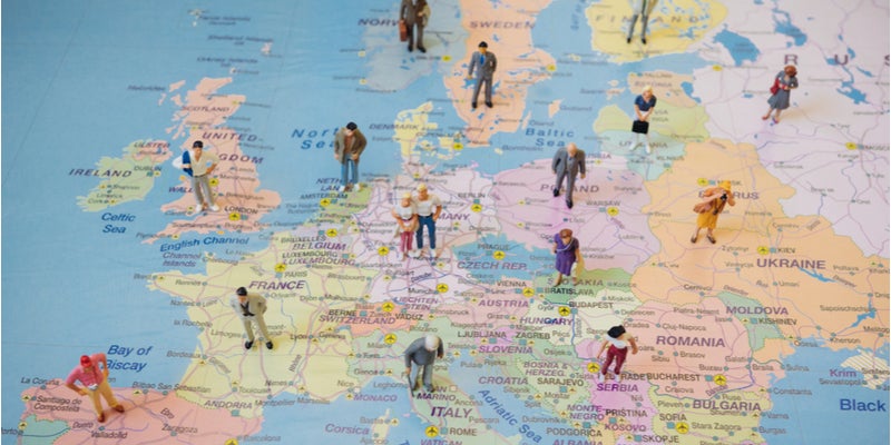 a map of Europe with miniature figures standing in various countries