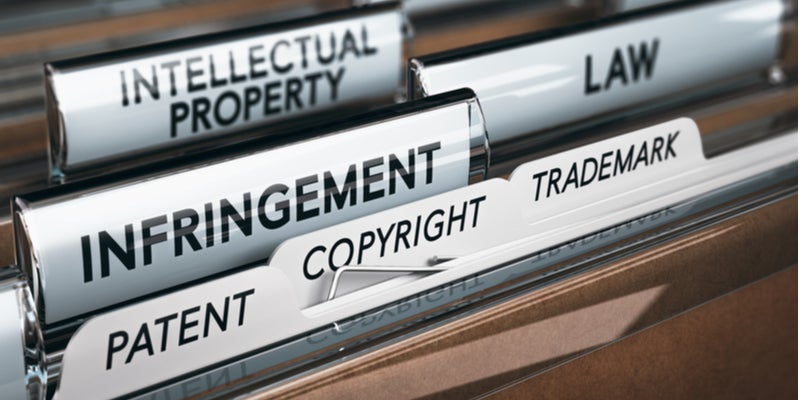 file folders labelled intellectual property, law, infringement, and copyright