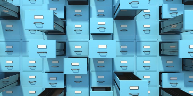 Blue filing cabinets with open drawers background.